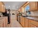 Well-lit kitchen featuring modern appliances, ample cabinet space, and a functional layout; RV view outside the window at 1325 Fairlee St, Lakeland, FL 33813