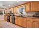 Functional kitchen featuring modern appliances, neutral countertops, and great cabinet space; RV view outside the window at 1325 Fairlee St, Lakeland, FL 33813