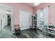 Bedroom with a closet, window, and grey wood-like flooring at 1495 Davis Ave, Bartow, FL 33830