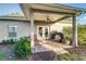 Covered patio featuring furniture, an outdoor grill, and a ceiling fan at 1495 Davis Ave, Bartow, FL 33830