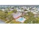 Aerial view of a community with a pool, clubhouse, and numerous mobile homes at 1610 Reynolds Rd # 236, Lakeland, FL 33801