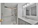 Modern bathroom with gray vanity and marble shower at 1610 Reynolds Rd # 236, Lakeland, FL 33801