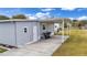 Home exterior with carport and landscaped yard at 1610 Reynolds Rd # 236, Lakeland, FL 33801