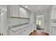 White cabinets and marble countertops in this kitchen at 1610 Reynolds Rd # 236, Lakeland, FL 33801