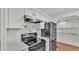 Modern kitchen with white cabinets, black appliances, and marble countertops at 1610 Reynolds Rd # 236, Lakeland, FL 33801