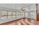 Sunlit living area with wood floors and multiple windows at 1610 Reynolds Rd # 236, Lakeland, FL 33801