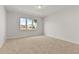 Bright bedroom with carpeted floor and large window at 171 Golden Noble St, Kissimmee, FL 34747