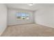 Spacious bedroom with a large window and carpet flooring at 171 Golden Noble St, Kissimmee, FL 34747