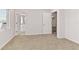 Simple bedroom with carpet flooring and access to a bathroom at 171 Golden Noble St, Kissimmee, FL 34747