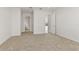 Bright and airy bedroom with carpet flooring and access to bathroom at 171 Golden Noble St, Kissimmee, FL 34747