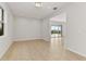 Simple dining room with tile floors and access to another room at 171 Golden Noble St, Kissimmee, FL 34747