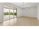 Dining room with tile floors and sliding glass doors to a patio at 171 Golden Noble St, Kissimmee, FL 34747