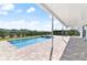 Covered patio overlooking refreshing pool at 171 Golden Noble St, Kissimmee, FL 34747