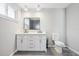 Stylish bathroom featuring a double vanity, modern fixtures and a window at 20 N Lake Idylwild Dr, Winter Haven, FL 33881