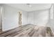 Bedroom featuring luxury vinyl plank flooring, recessed lighting, closet, and an entrance to a bathroom at 20 N Lake Idylwild Dr, Winter Haven, FL 33881