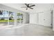 Bright bedroom with tile floors, sliding glass doors to the outside, and spacious closet at 20 N Lake Idylwild Dr, Winter Haven, FL 33881