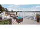 Inviting outdoor living space with comfortable wicker furniture and scenic waterfront views at 20 N Lake Idylwild Dr, Winter Haven, FL 33881