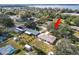 Aerial view of single Gathering home, large backyard, and neighborhood at 2004 Varner Cir, Winter Haven, FL 33884