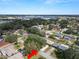 Aerial view showcasing home's neighborhood and nearby lake at 2004 Varner Cir, Winter Haven, FL 33884