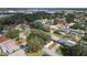 Aerial view showcasing home's neighborhood and nearby lake at 2004 Varner Cir, Winter Haven, FL 33884