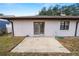 Home's backyard with a patio and grassy area at 2004 Varner Cir, Winter Haven, FL 33884