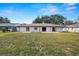 Large backyard with grassy area and partial view of the house at 2004 Varner Cir, Winter Haven, FL 33884