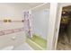 Bathroom with a shower/tub combo and floral shower curtain at 2004 Varner Cir, Winter Haven, FL 33884