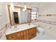 Bathroom with double vanity, a toilet and a shower/tub combo at 2004 Varner Cir, Winter Haven, FL 33884