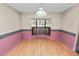 Bright dining room features a bay window and wood-look flooring at 2004 Varner Cir, Winter Haven, FL 33884