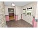 Brick floor entryway with double doors and view to living room at 2004 Varner Cir, Winter Haven, FL 33884