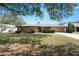 House exterior featuring stone accents and landscaping at 2004 Varner Cir, Winter Haven, FL 33884