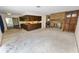 Living room with brick fireplace and built-in wooden cabinet at 2004 Varner Cir, Winter Haven, FL 33884