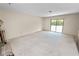 Bright living room with sliding glass doors leading to backyard at 2004 Varner Cir, Winter Haven, FL 33884