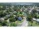 Aerial view of property showcasing location within a residential neighborhood and mature trees at 2016 Seminole Trl, Lakeland, FL 33803