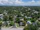 Aerial view of property in residential area with mature trees and proximity to nearby lake at 2016 Seminole Trl, Lakeland, FL 33803