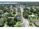 Aerial view showcasing the beautiful property, mature trees, and neighborhood at 2016 Seminole Trl, Lakeland, FL 33803