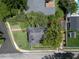 Aerial view of a charming home with well-maintained landscaping and clearly marked property lines at 2016 Seminole Trl, Lakeland, FL 33803