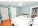 Serene bedroom with light blue walls, hardwood floors, and ample closet space at 2016 Seminole Trl, Lakeland, FL 33803