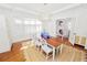 Bright dining room with hardwood floors, a farmhouse table, and built-in window seat at 2016 Seminole Trl, Lakeland, FL 33803