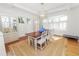 Bright dining room with hardwood floors, a large table, and white chairs at 2016 Seminole Trl, Lakeland, FL 33803