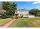 Two story house with a brick walkway leading to the front porch at 2016 Seminole Trl, Lakeland, FL 33803