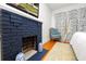 Dark blue brick fireplace in a bedroom setting at 2016 Seminole Trl, Lakeland, FL 33803