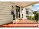 Front door entrance with tiled flooring and lush landscaping at 2016 Seminole Trl, Lakeland, FL 33803