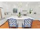 Kitchen boasts a large island with marble countertop and blue chairs at 2016 Seminole Trl, Lakeland, FL 33803