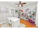 Bright home office with hardwood floors and built in shelving at 2016 Seminole Trl, Lakeland, FL 33803