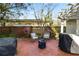 Brick patio with seating area and grill at 2016 Seminole Trl, Lakeland, FL 33803