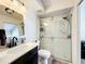 Bathroom featuring a modern vanity and a tiled walk-in shower with sliding glass doors at 2025 Sylvester Rd # N304, Lakeland, FL 33803