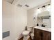 Simple bathroom with a wooden vanity and a toilet at 2025 Sylvester Rd # N304, Lakeland, FL 33803