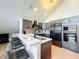 Updated kitchen featuring dark cabinetry and marble countertops at 2025 Sylvester Rd # N304, Lakeland, FL 33803