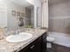 Guest bathroom with single vanity and bathtub at 2210 Oldham Ct, Haines City, FL 33844